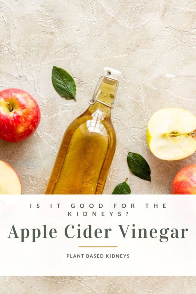 Pieces of apple with a jar of apple cider vinegar