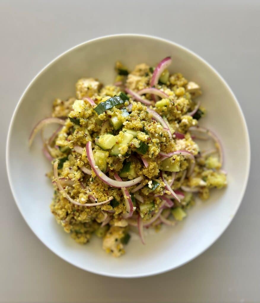 Cucumber quinoa salad with red onion, basil, and a garlic lemon dressing.