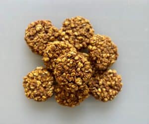 Pile of cooked healthy peanut butter pumpkin cookies.