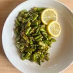 Sauteed asparagus in garlic, salt, pepper and lemon juice.