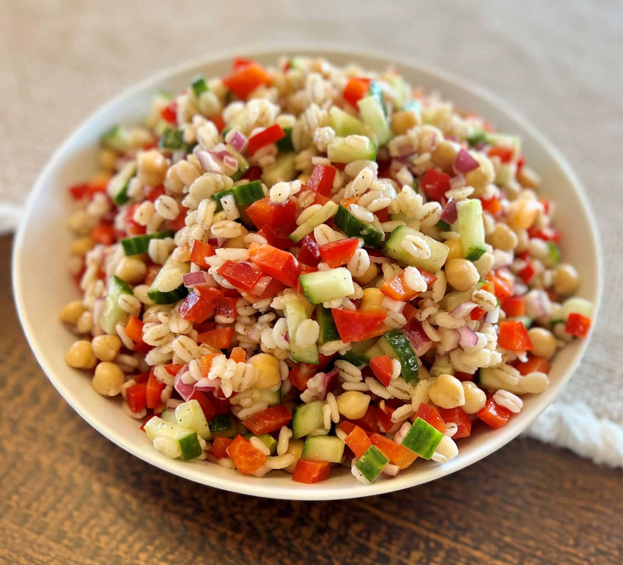 Kidney-friendly barley & veggie salad with colorful veggies and a tangy lemon garlic dressing.