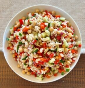Kidney-Friendly Barley & Veggie Salad with barley, onion, bell pepper, cucumber, chickpeas and a lemon garlic dressing.