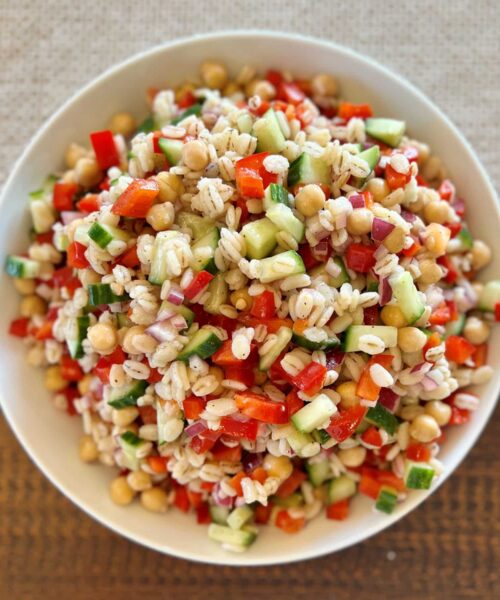 Kidney-Friendly Barley & Veggie Salad with barley, onion, bell pepper, cucumber, chickpeas and a lemon garlic dressing.