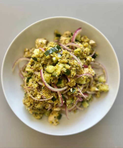 Cucumber quinoa salad with red onion, basil, and a garlic lemon dressing.