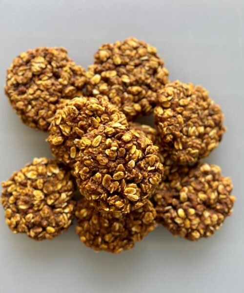 Pile of cooked healthy peanut butter pumpkin cookies.