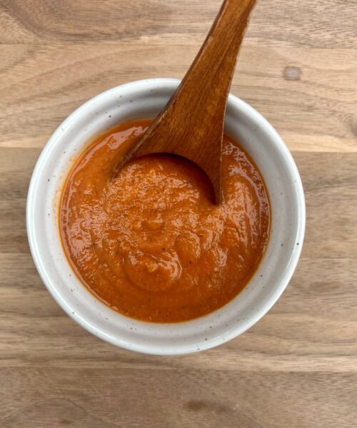 Low sodium roasted veggie pasta sauce in a bowl with a spoon.
